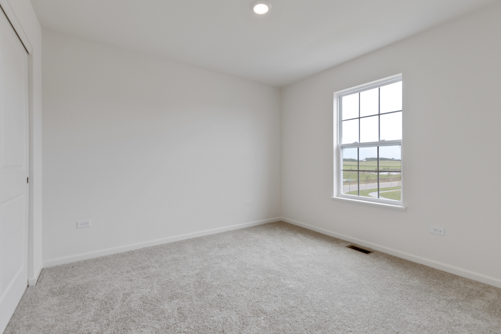 1464 Collins Street Elburn, IL 60119 - Photo 8 of 15 an empty room with a window