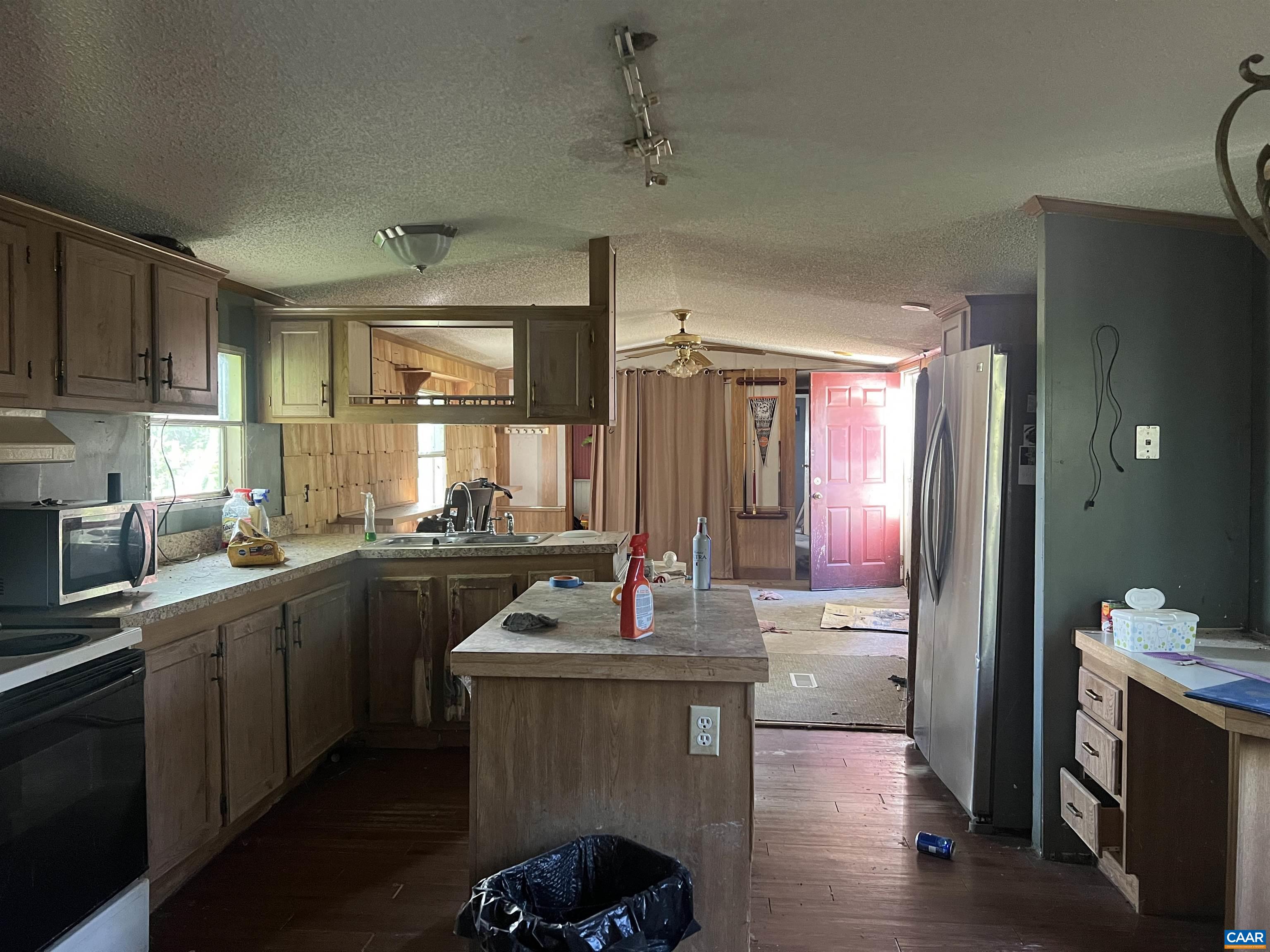 19 Mathews Lane Lyndhurst, VA 22952 - Photo 13 of 70 a kitchen with sink refrigerator and microwave