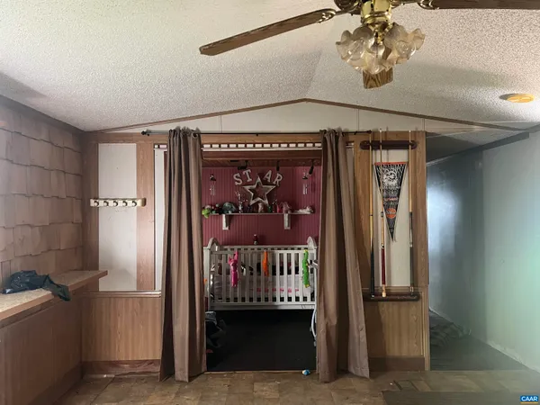 a view of a chair and table in the garden