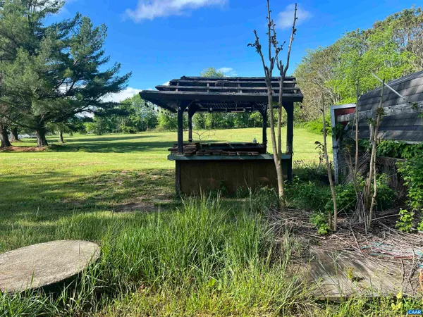 a view of outdoor space with deck and yard