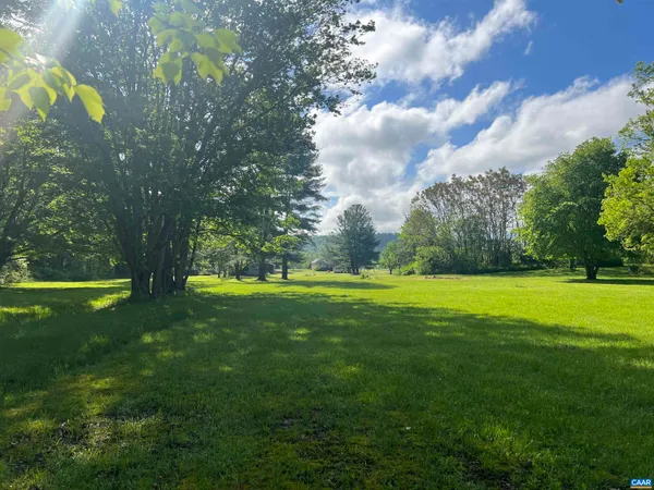 a view of a swimming pool with a yard