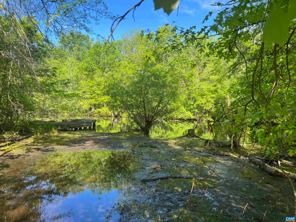 a view of a golf course with a lake