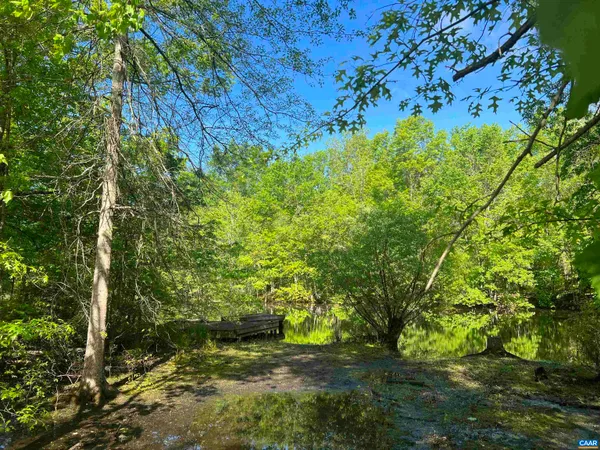 a view of a swimming pool with an outdoor space and seating area