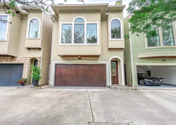a front view of a house with parking