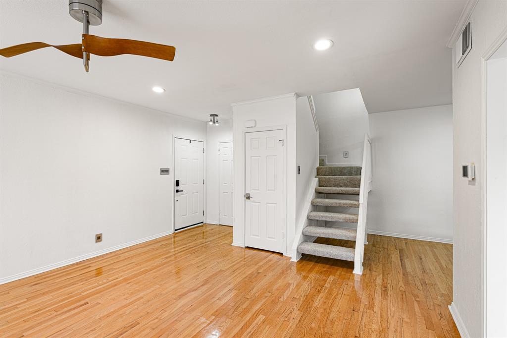 4130 Proton Drive, Unit 13A Addison, TX 75001 - Photo 18 of 40 Stairway with wood finished floors and recessed lighting