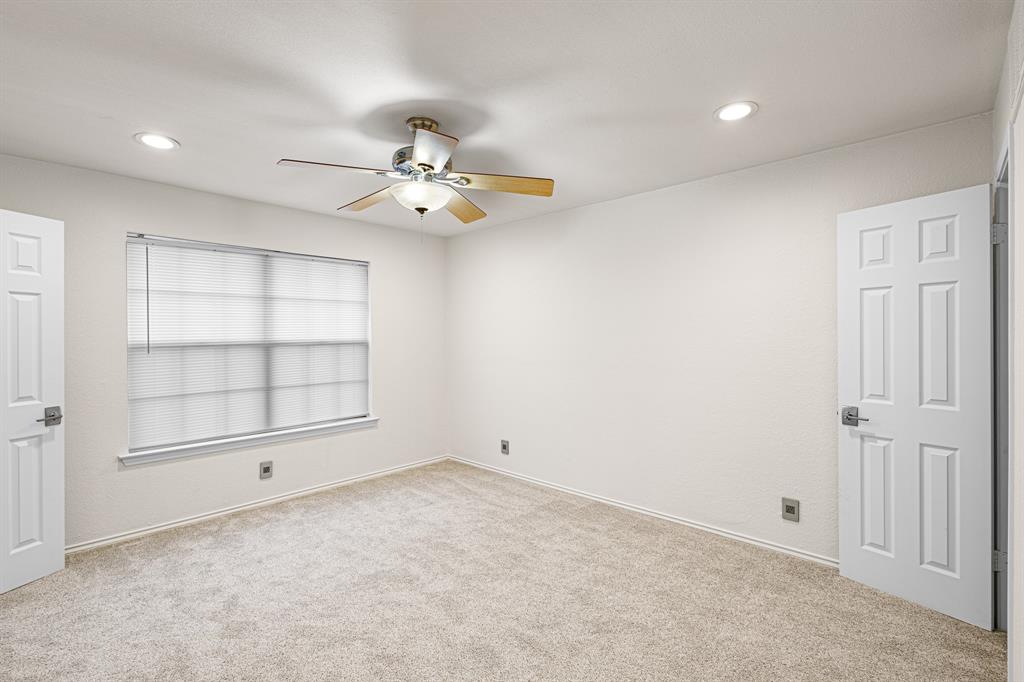 4130 Proton Drive, Unit 13A Addison, TX 75001 - Photo 21 of 40 Spare room featuring light colored carpet, recessed lighting, and a ceiling fan