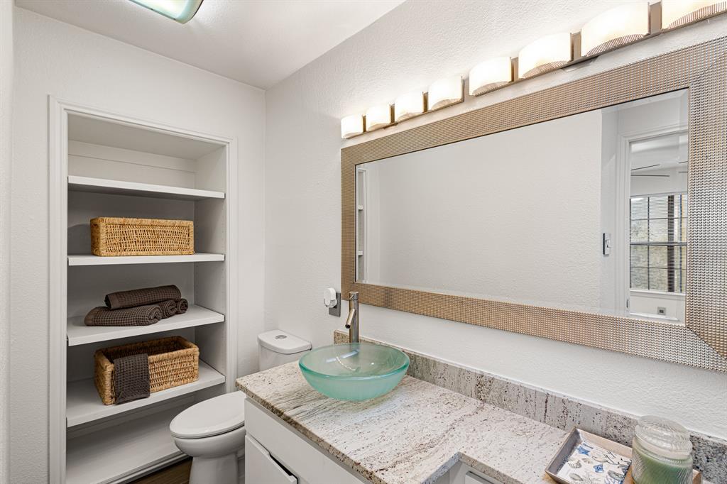 4130 Proton Drive, Unit 13A Addison, TX 75001 - Photo 27 of 40 Bathroom featuring vanity and a textured wall