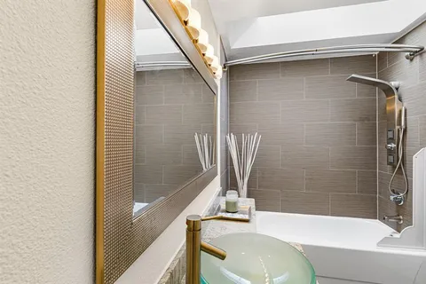 a bathroom with a sink and a bathtub