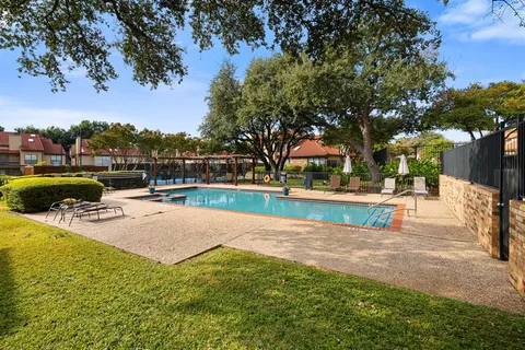 a view of swimming pool with seating space