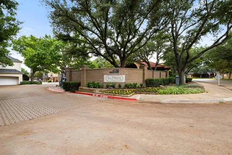 a view of street with large trees