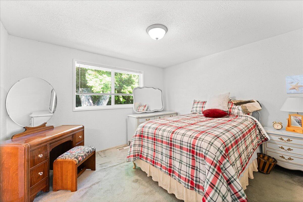 4093 Old Upton Road Central Point, OR 97502 - Photo 17 of 23 a bedroom with a bed and a window