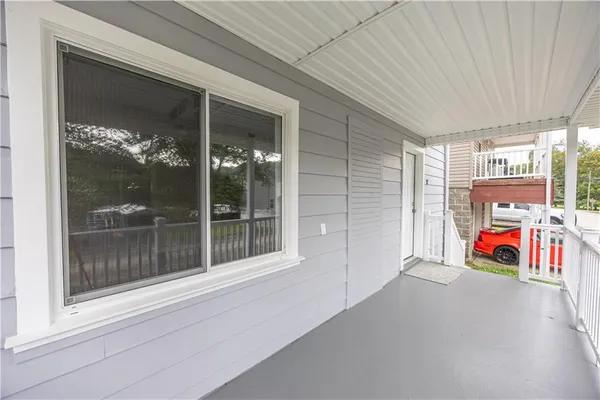 a view of entryway with wooden floor