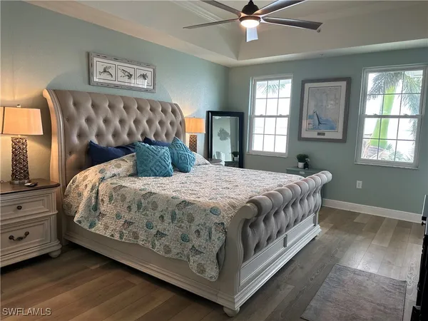 a bathroom with a granite countertop sink a large mirror and a shower
