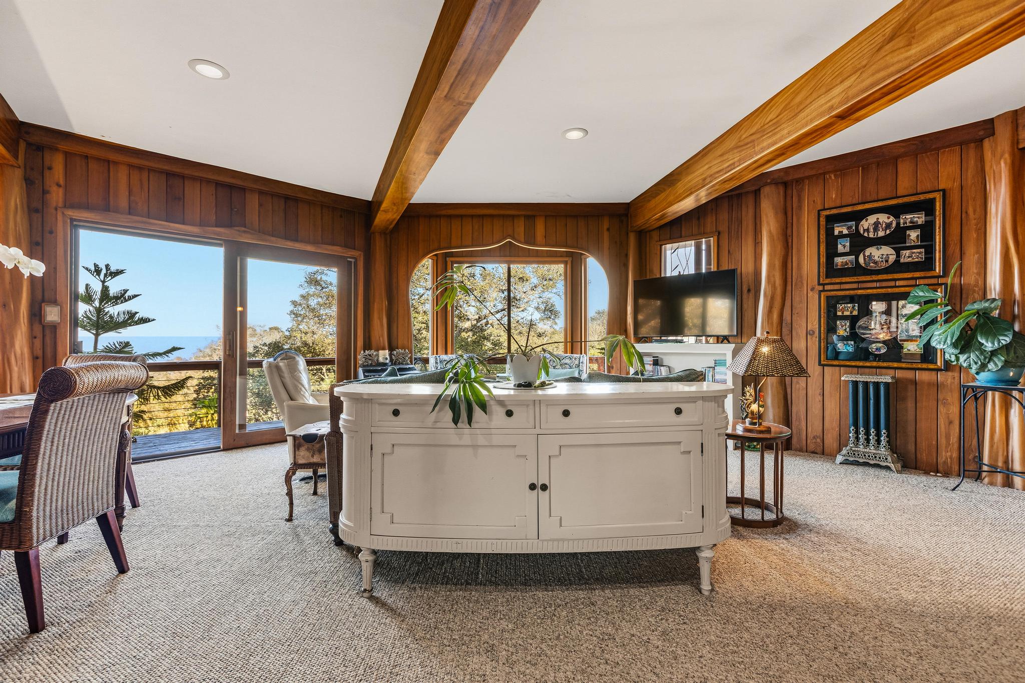 43-5745 Old Stable Road Paauilo, HI 96776 - Photo 13 of 30 a living room with furniture a floor to ceiling window and a flat screen tv