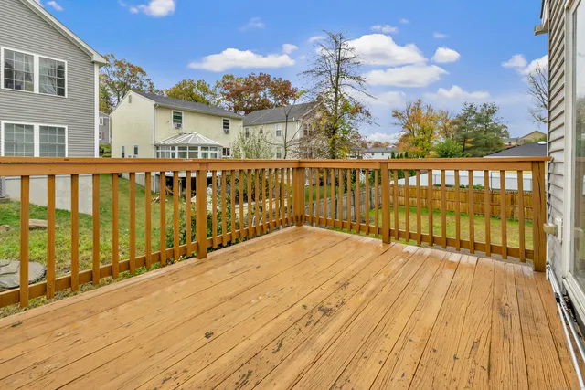 a view of a balcony with wooden floor
