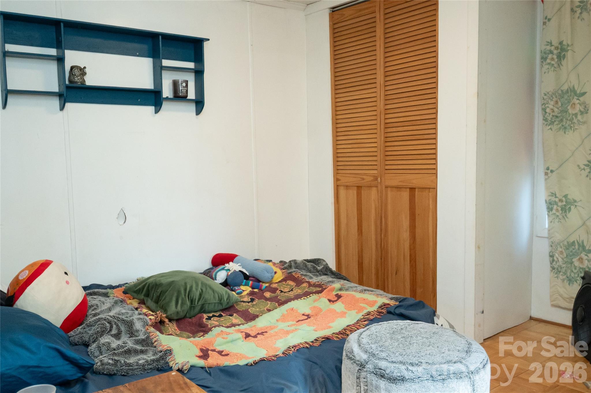 910 Summit Ridge Road Purlear, NC 28665 - Photo 18 of 25 a bed room with a bed and a window