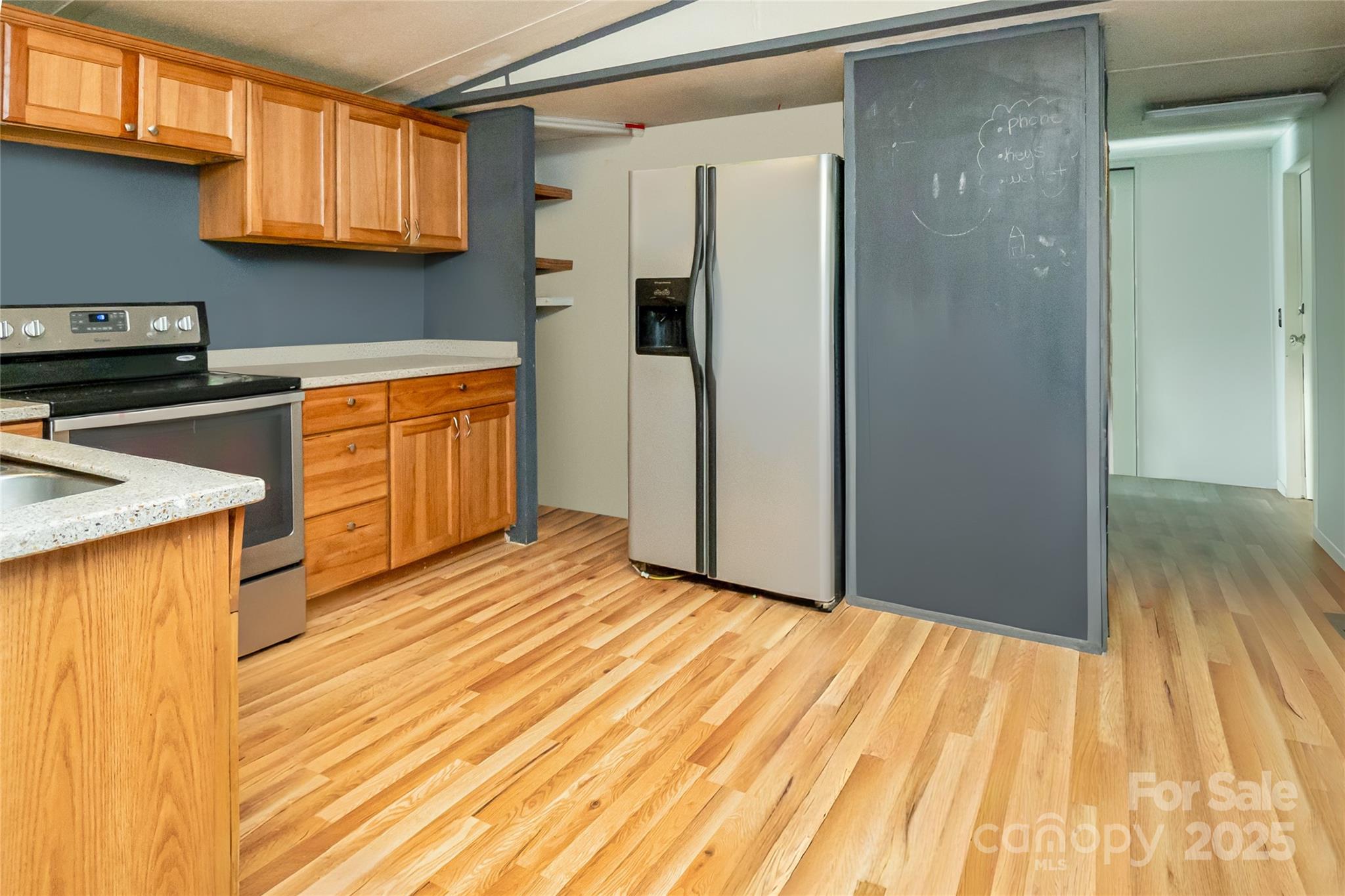910 Summit Ridge Road Purlear, NC 28665 - Photo 2 of 28 a view of a kitchen with wooden floor and a sink