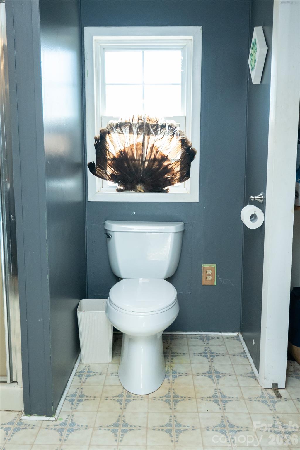 910 Summit Ridge Road Purlear, NC 28665 - Photo 21 of 25 a bathroom with a toilet and a window