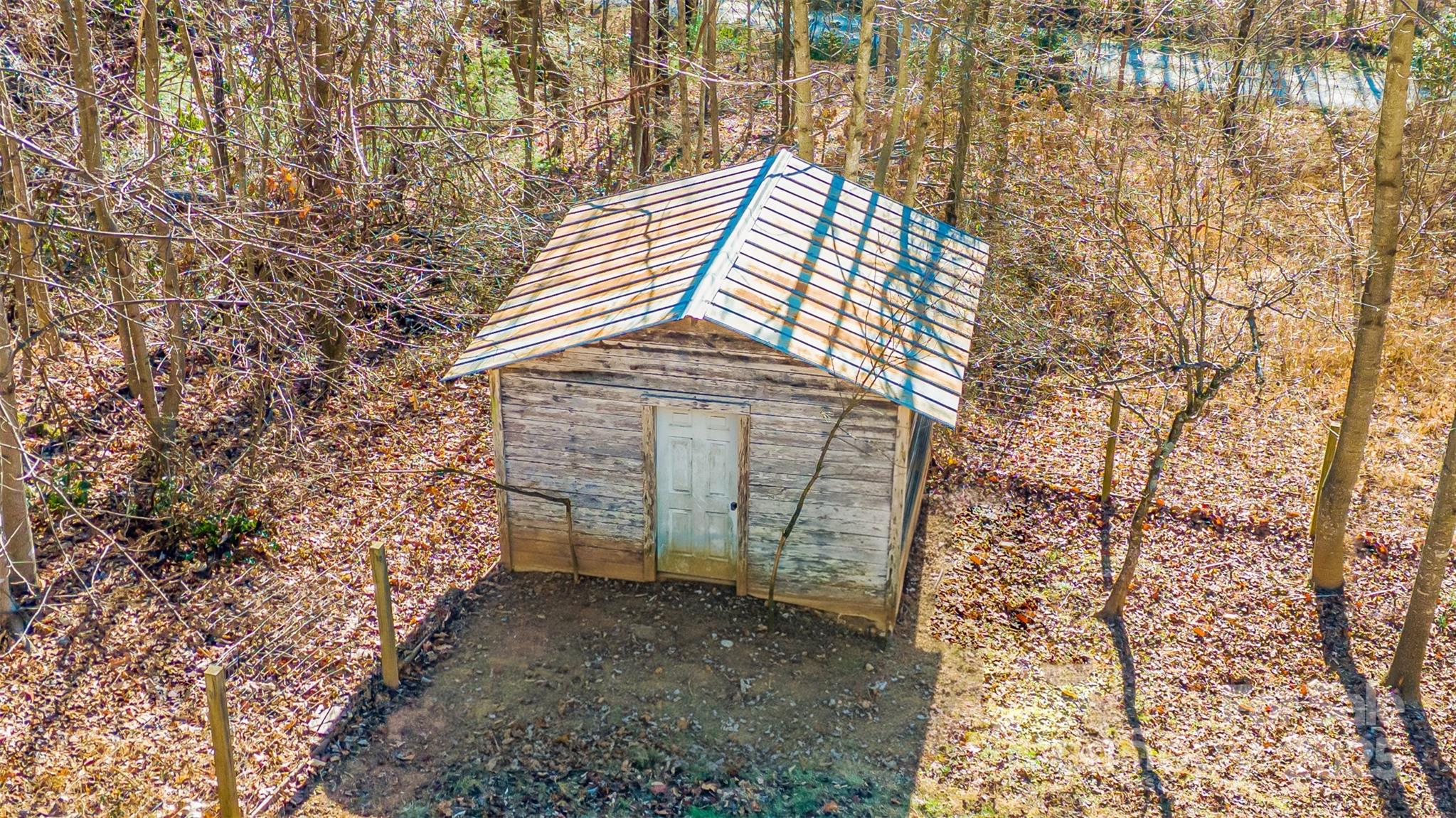 910 Summit Ridge Road Purlear, NC 28665 - Photo 22 of 28 a backyard of a house with lots of green space