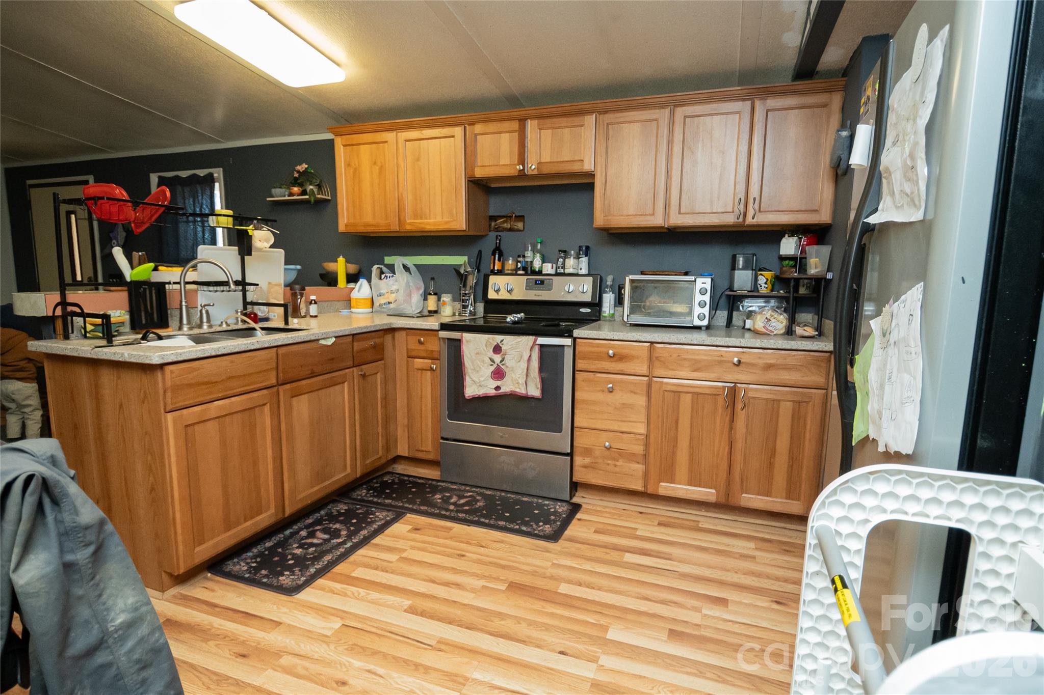 910 Summit Ridge Road Purlear, NC 28665 - Photo 25 of 25 a kitchen with granite countertop a stove and cabinets