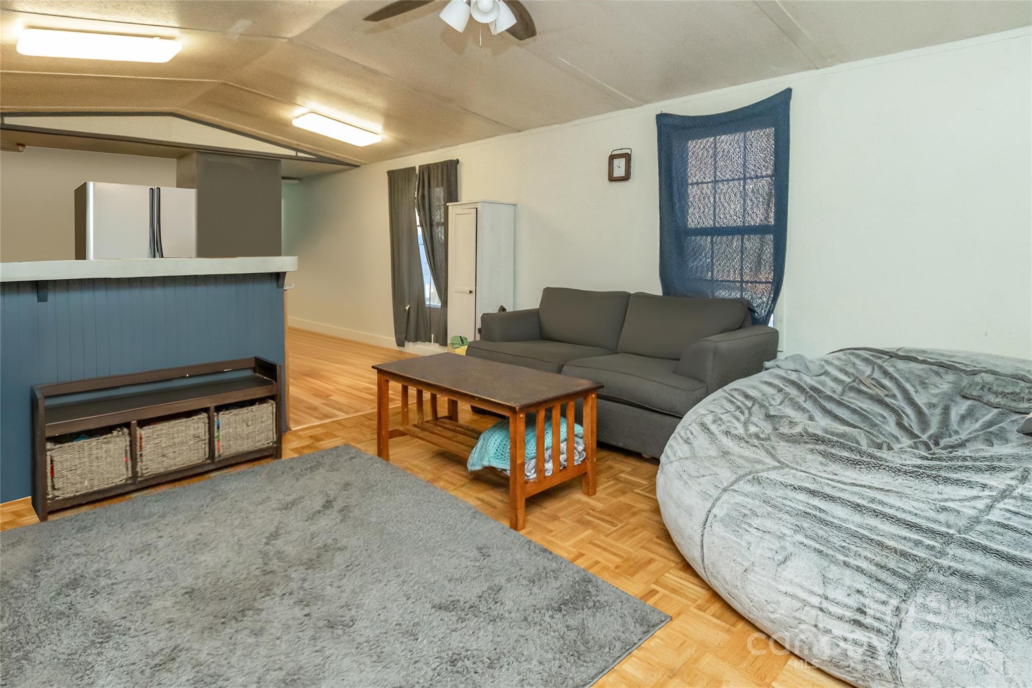 910 Summit Ridge Road Purlear, NC 28665 - Photo 4 of 28 a living room with furniture and a wooden floor