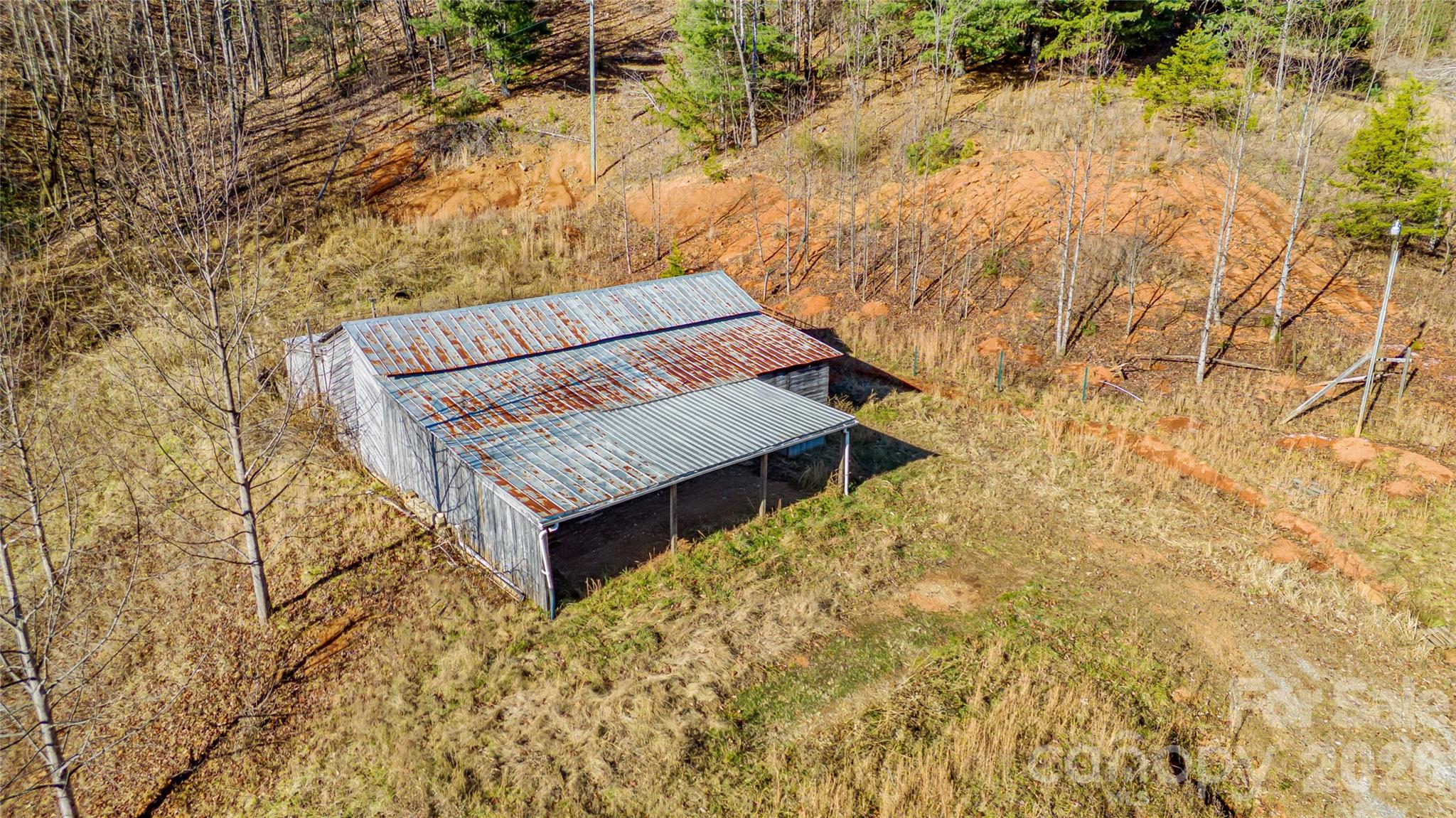 910 Summit Ridge Road Purlear, NC 28665 - Photo 6 of 17 a view of a backyard with trees