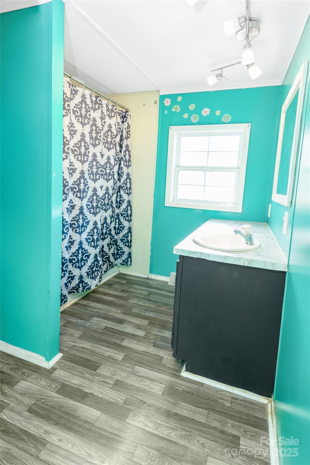 910 Summit Ridge Road Purlear, NC 28665 - Photo 6 of 28 a room with window shower and a wooden floor