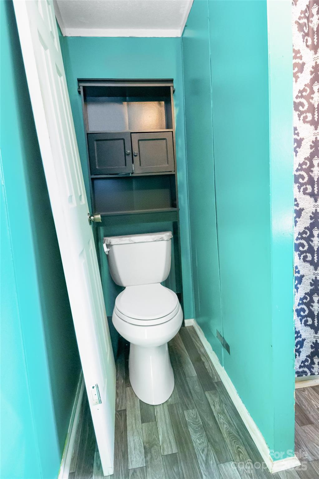 910 Summit Ridge Road Purlear, NC 28665 - Photo 7 of 28 a bathroom with a toilet and a sink