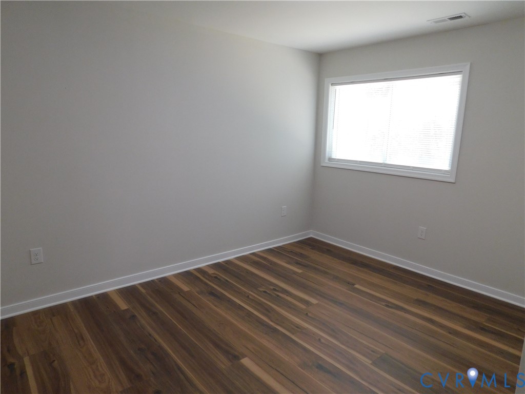 5322 Adams Road Quinton, VA 23141 - Photo 50 of 56 Neutral wall tones with wood-finish flooring