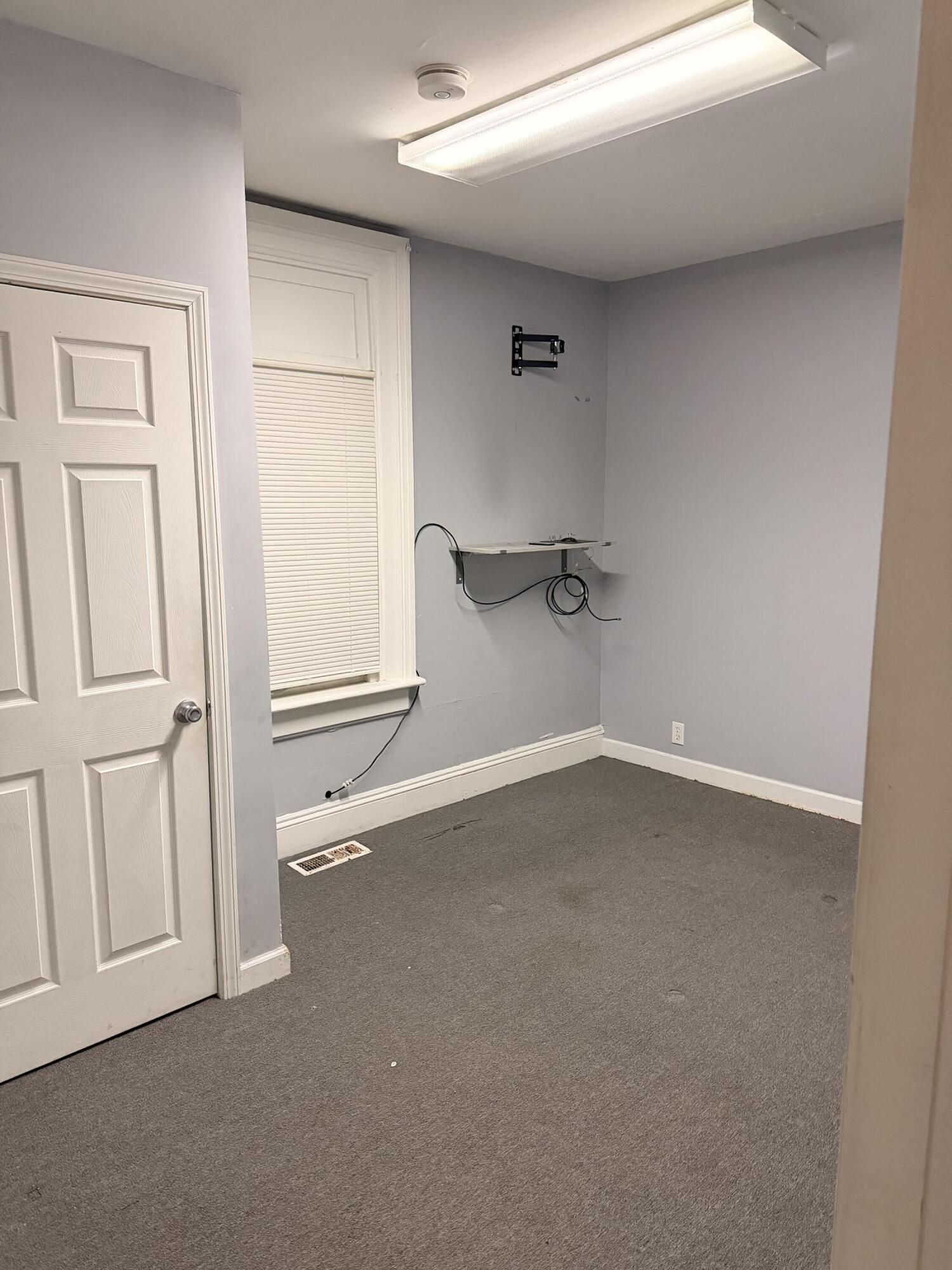 319 East Ridge Road Griffith, IN 46319 - Photo 7 of 10 an empty room with windows