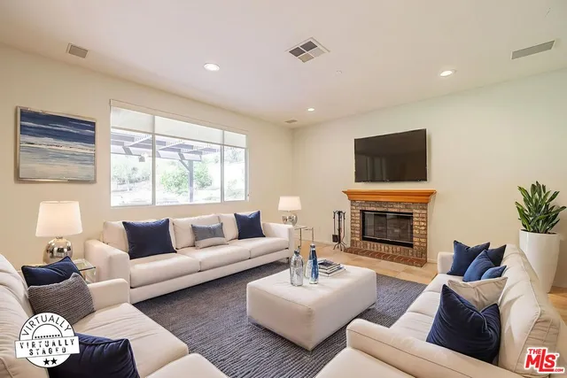 a view of an empty room with wooden floor and closet