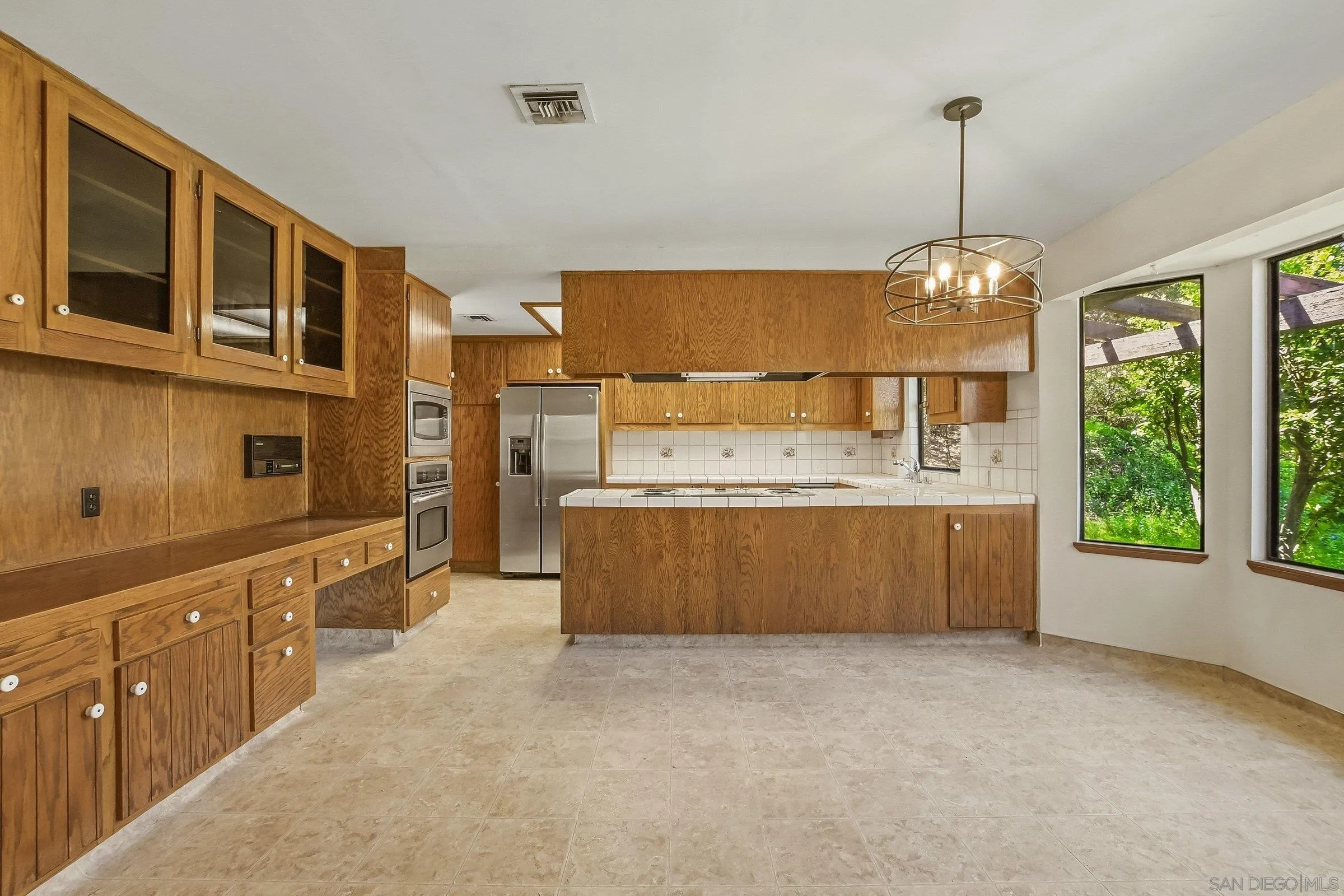 9907 Anderson Ranch Road Descanso, CA 91916 - Photo 11 of 42 a kitchen with stainless steel appliances granite countertop a stove a sink dishwasher and a oven with cabinets