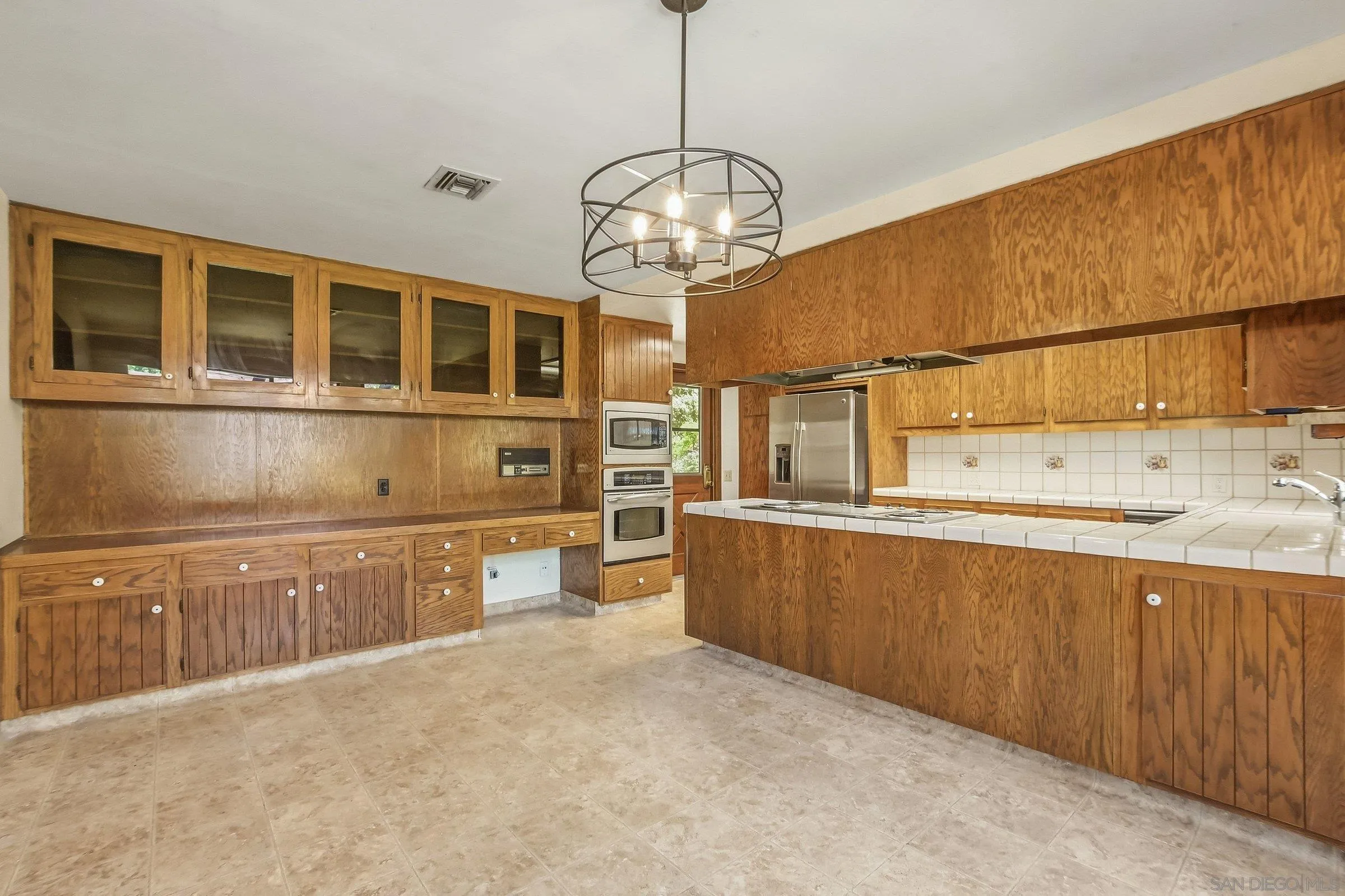 9907 Anderson Ranch Road Descanso, CA 91916 - Photo 12 of 42 a kitchen with stainless steel appliances granite countertop a sink and cabinets