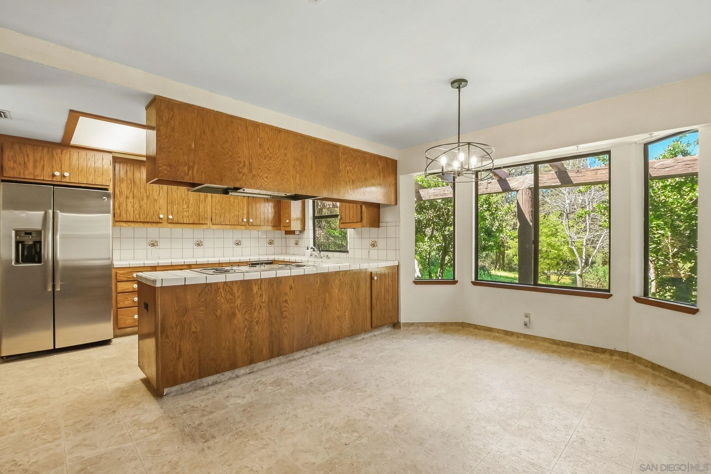 9907 Anderson Ranch Road Descanso, CA 91916 - Photo 15 of 42 a kitchen with stainless steel appliances granite countertop a stove and a refrigerator