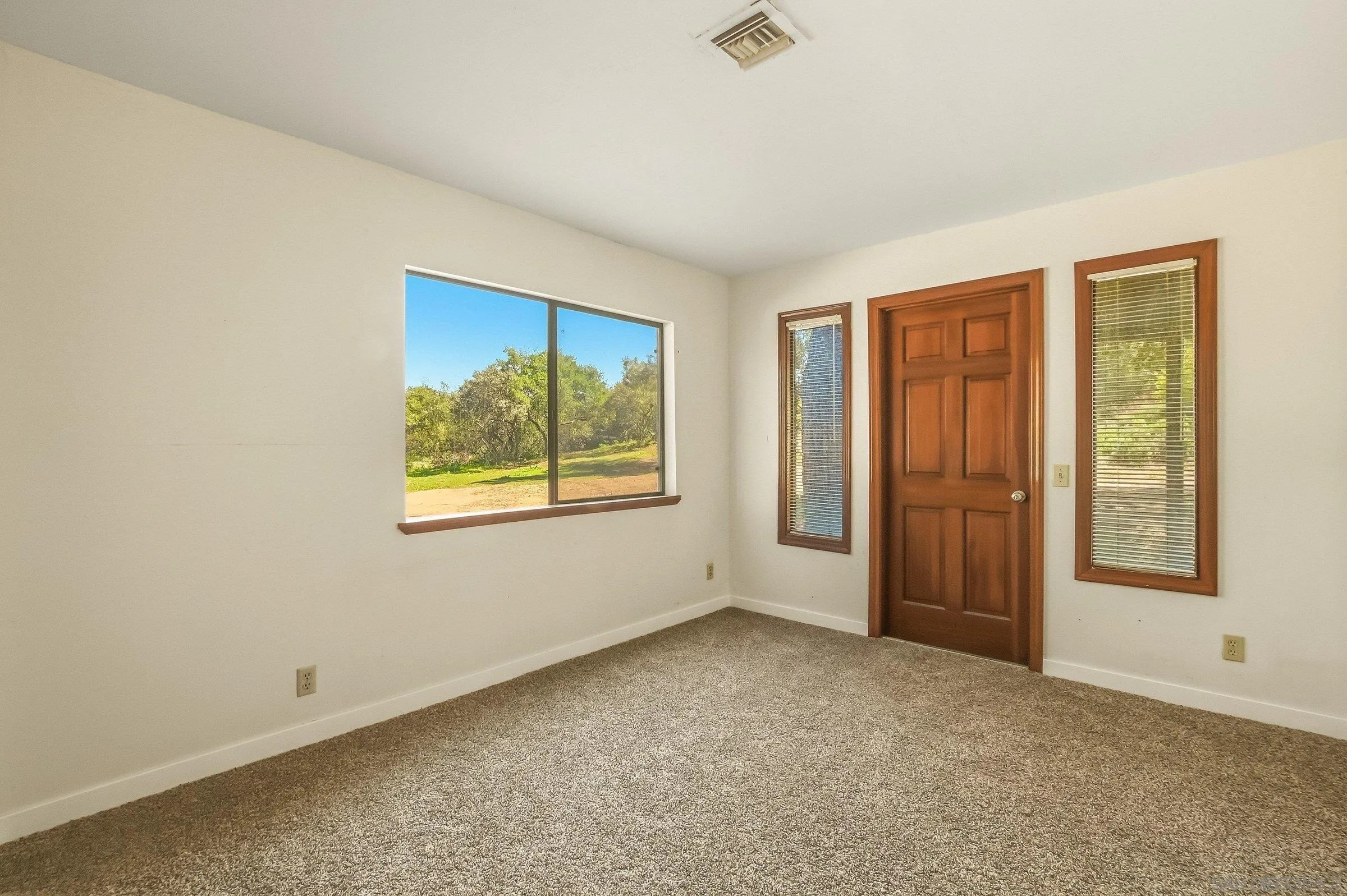 9907 Anderson Ranch Road Descanso, CA 91916 - Photo 19 of 42 an empty room with windows and closet