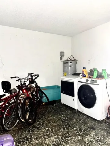 a view of an entryway with wooden floor