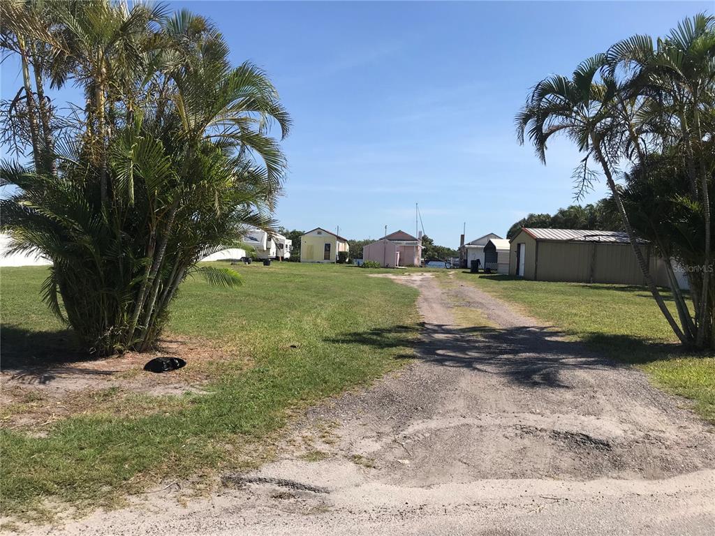 3306 West Shell Point Road Ruskin, FL 33570 - Photo 3 of 10 a view of a yard with a slide