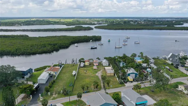 an aerial view of a city and lake view