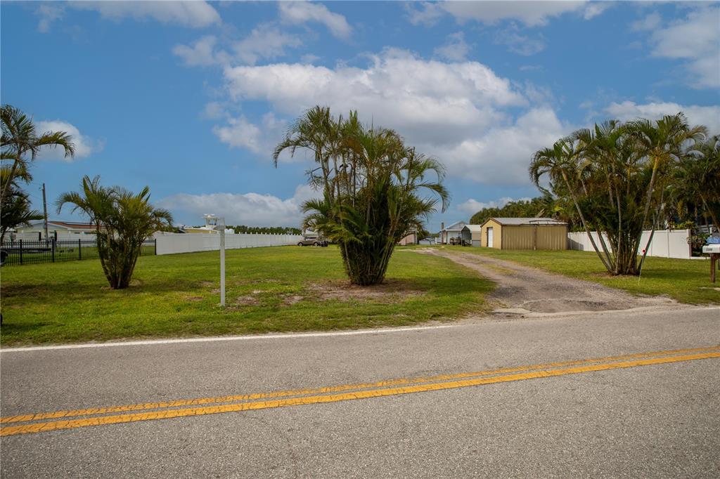 3306 West Shell Point Road Ruskin, FL 33570 - Photo 10 of 10 a view of a yard in front of a house