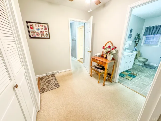 a bathroom with a tub sink and a mirror