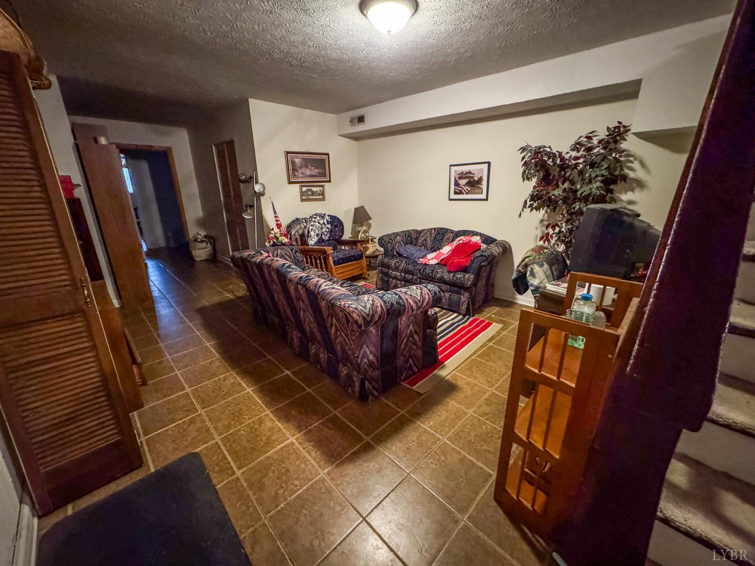 88 Jean Place Evington, VA 24550 - Photo 25 of 46 a living room with furniture and a flat screen tv