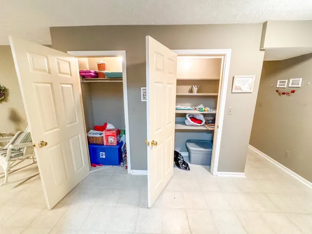 a kitchen with a sink a stove and wooden floor