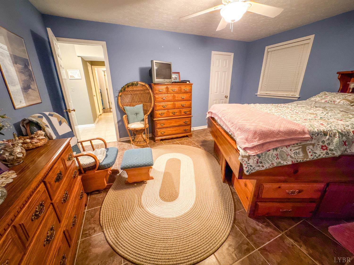 88 Jean Place Evington, VA 24550 - Photo 33 of 46 a bedroom with bed and a mirror