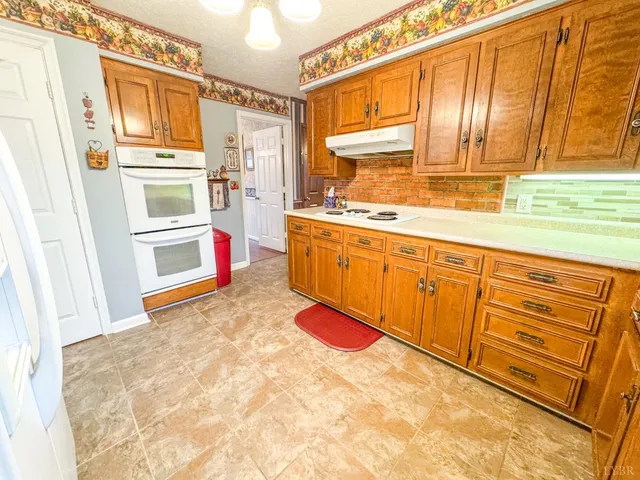 a view of a bedroom with furniture and staircase