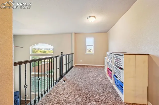 a view of a hallway with windows