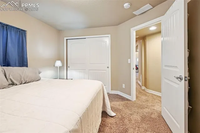 a bedroom with a bed and a table