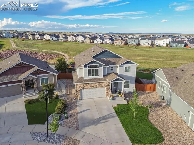 an aerial view of a house with a ocean view
