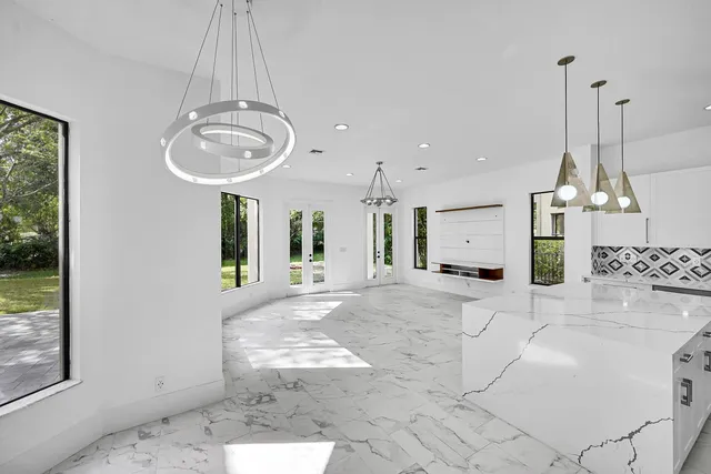 a bathroom with a sink toilet a mirror and shower