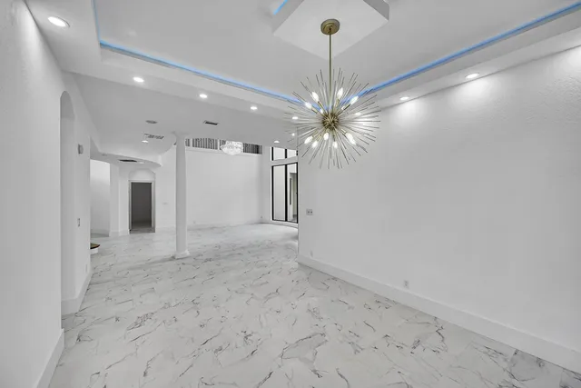 a bathroom with a granite countertop sink mirror bathtub and shower