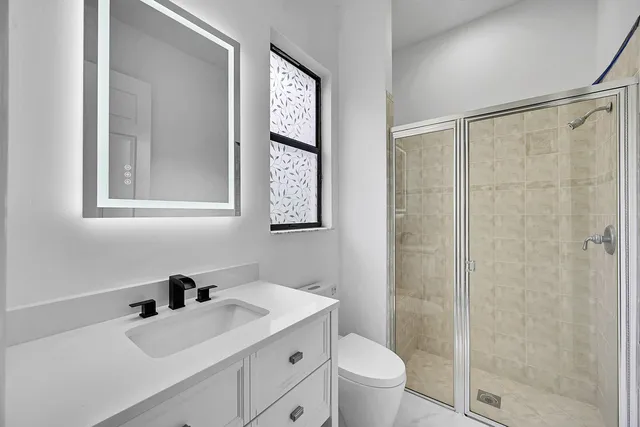a bathroom with a white bath tub and a shower